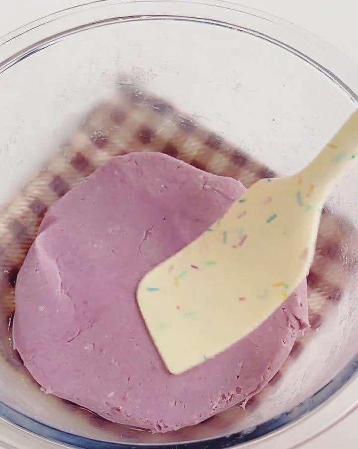 Use a silicone spatula to mix until the taro paste becomes glossy