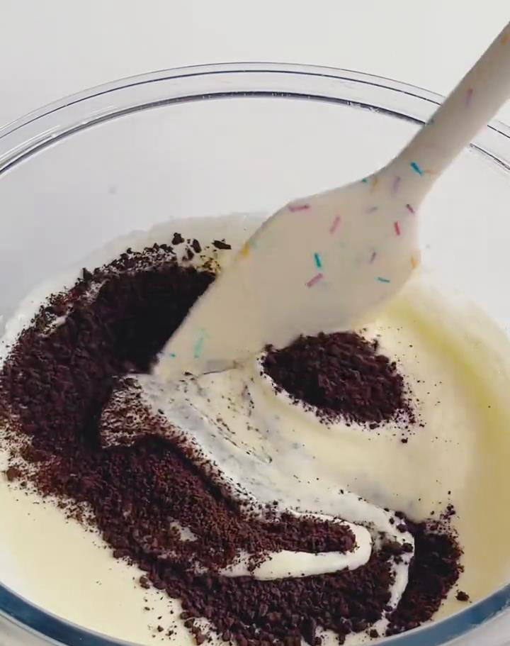 fold in the crushed Oreo crumbs