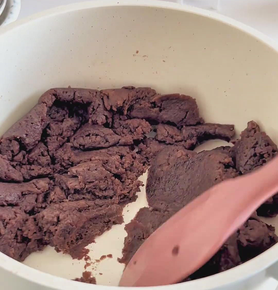 stirring constantly to remove excess moisture