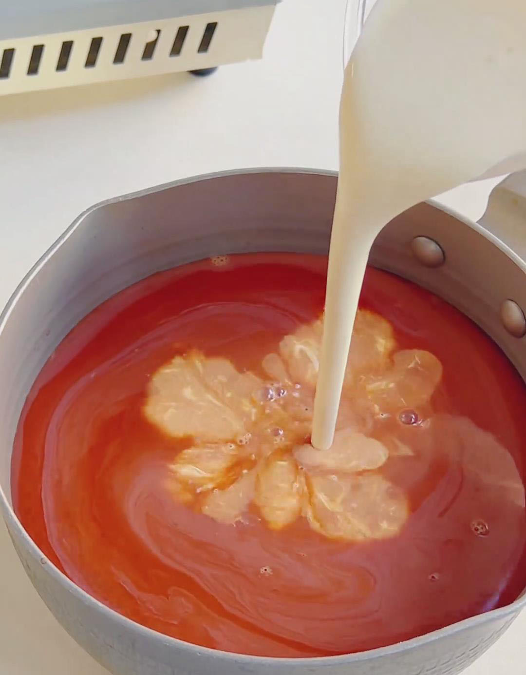 Add condensed milk, sugar, milk, and whipping cream to the hot Thai tea