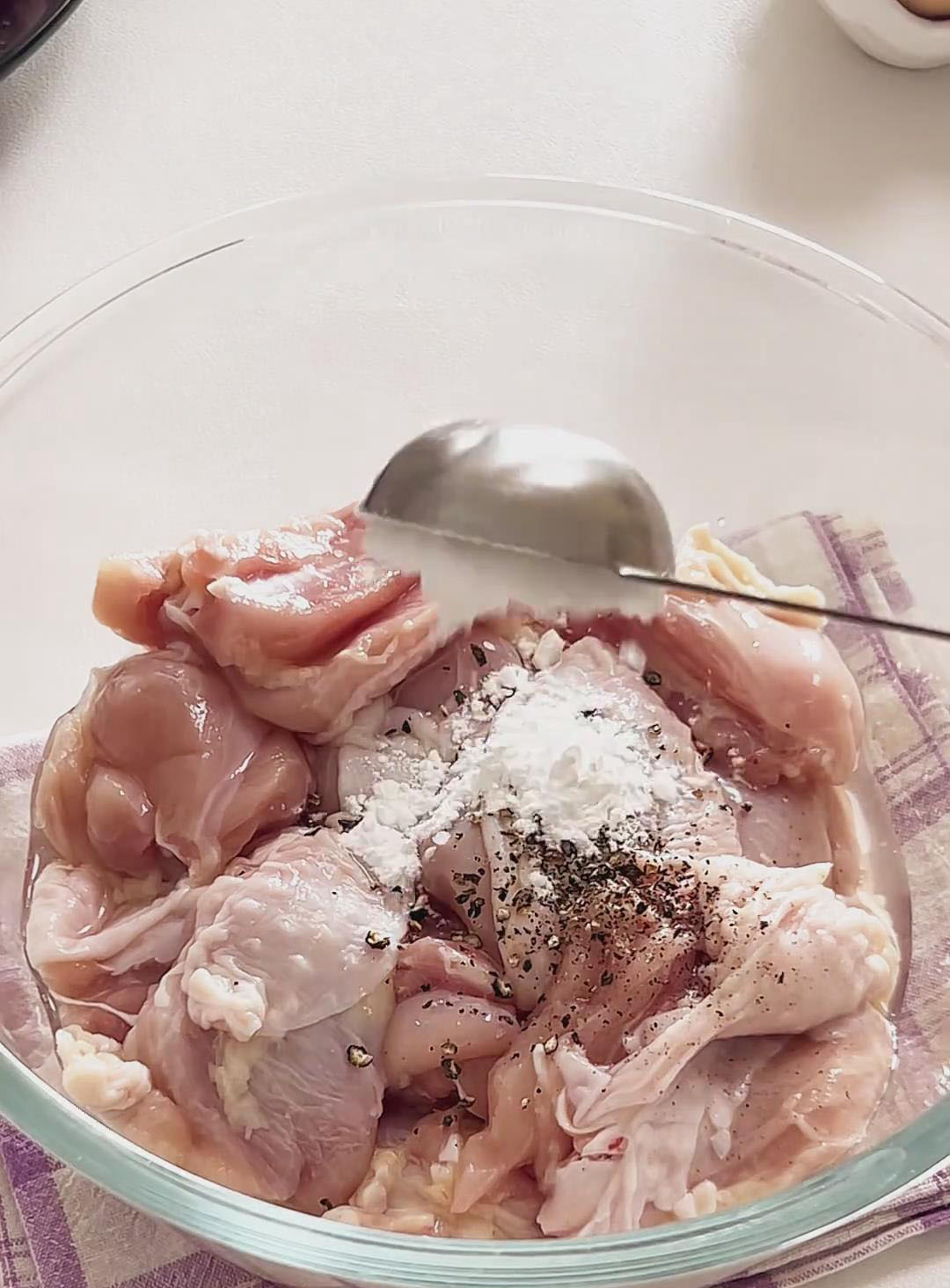 Add the chicken to a bowl with cooking wine, cornstarch, and black pepper