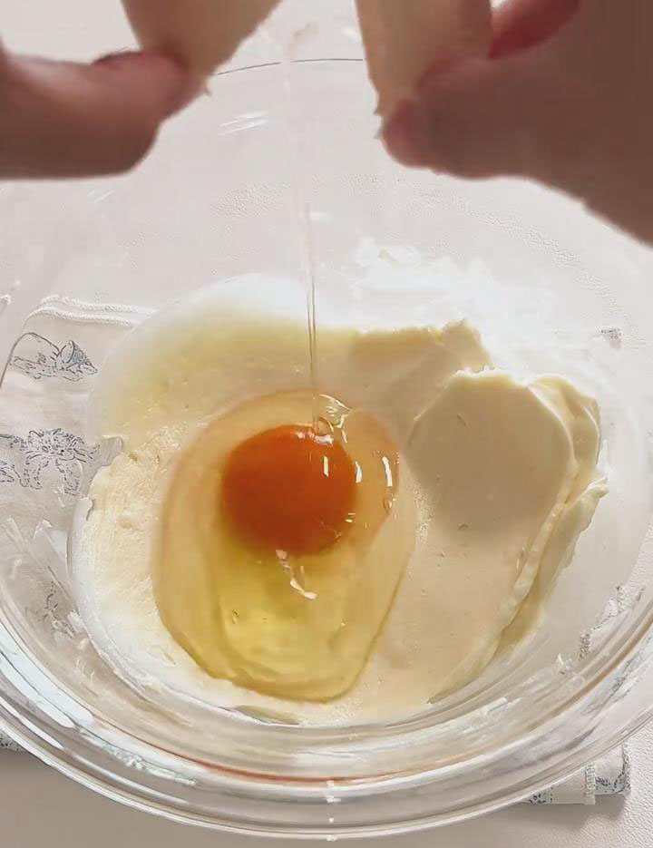 Add the eggs in two additions