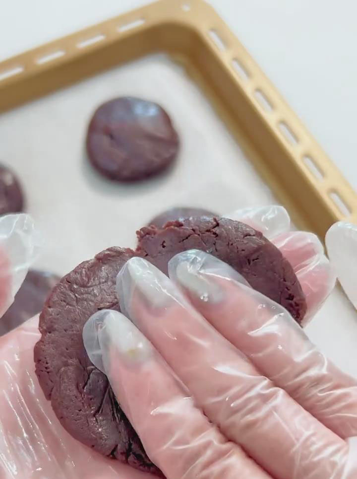 Flatten one dough ball into a small disc