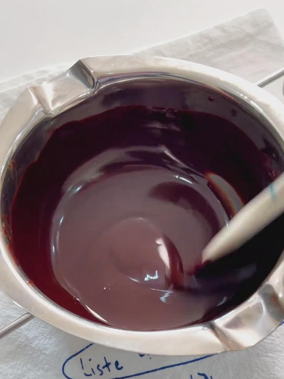 Melt the butter and dark chocolate together over a hot water bath