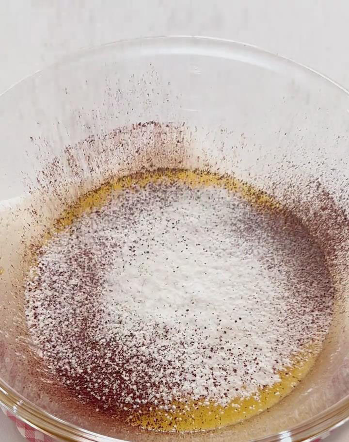 Sift cake flour, cocoa powder, and baking powder directly into the bowl