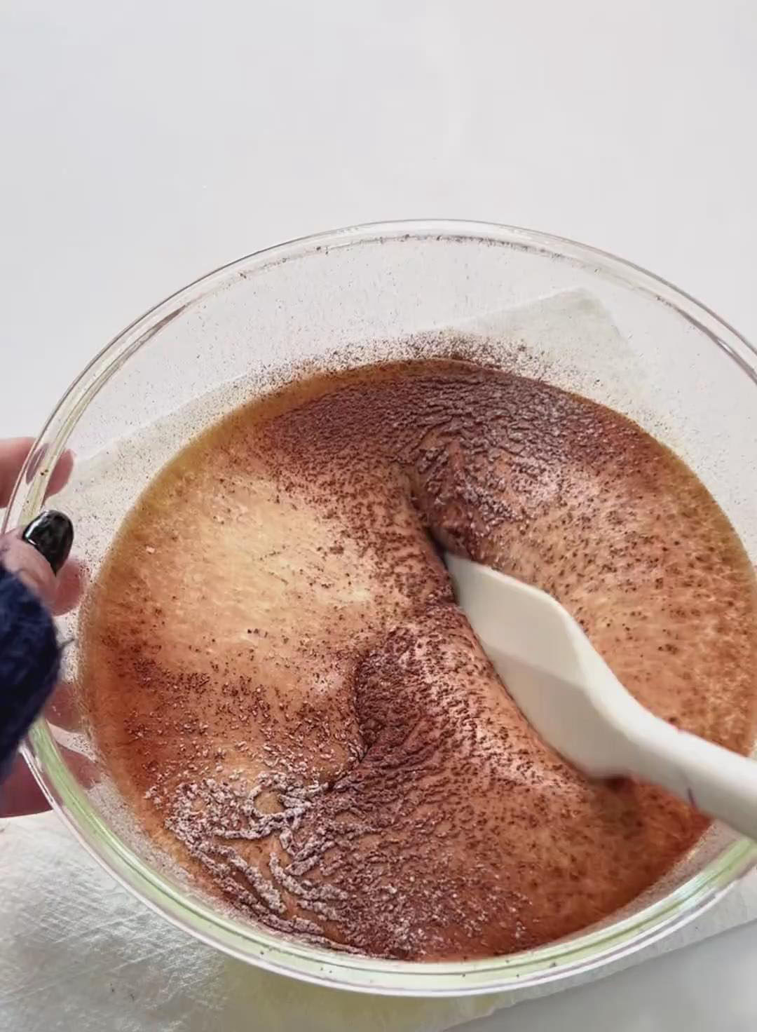 Sift the 55g of cake flour and 25g of cocoa powder directly into the egg mixture