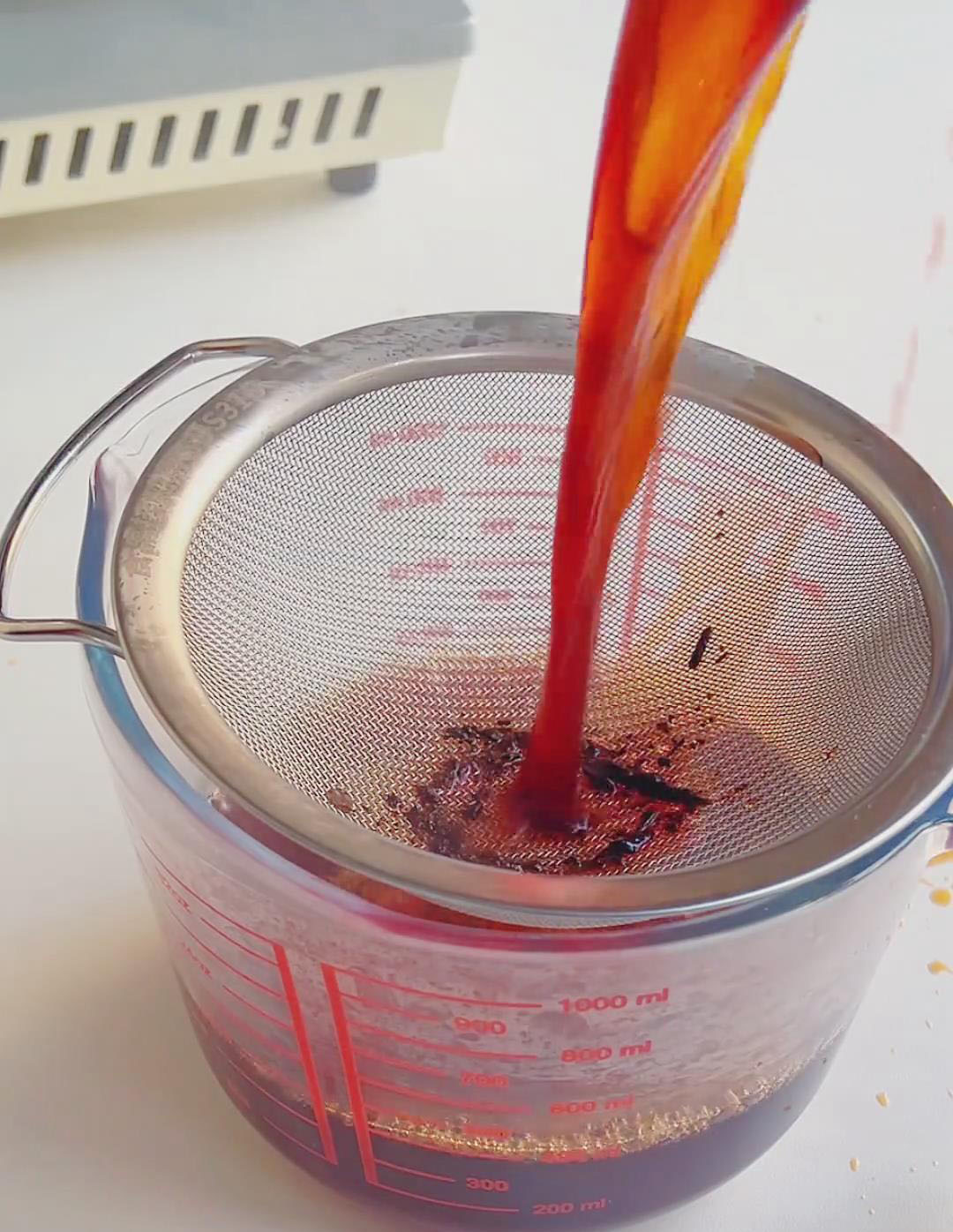 Strain through a fine sieve to remove the tea leaves