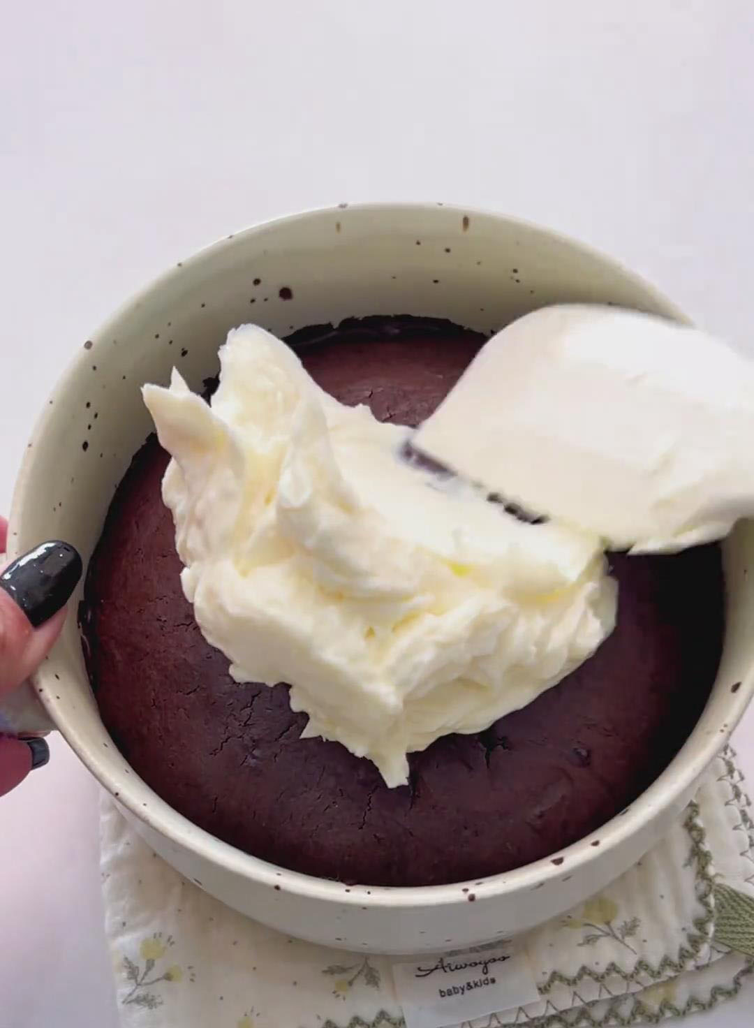 spread the cream cheese frosting evenly over the top